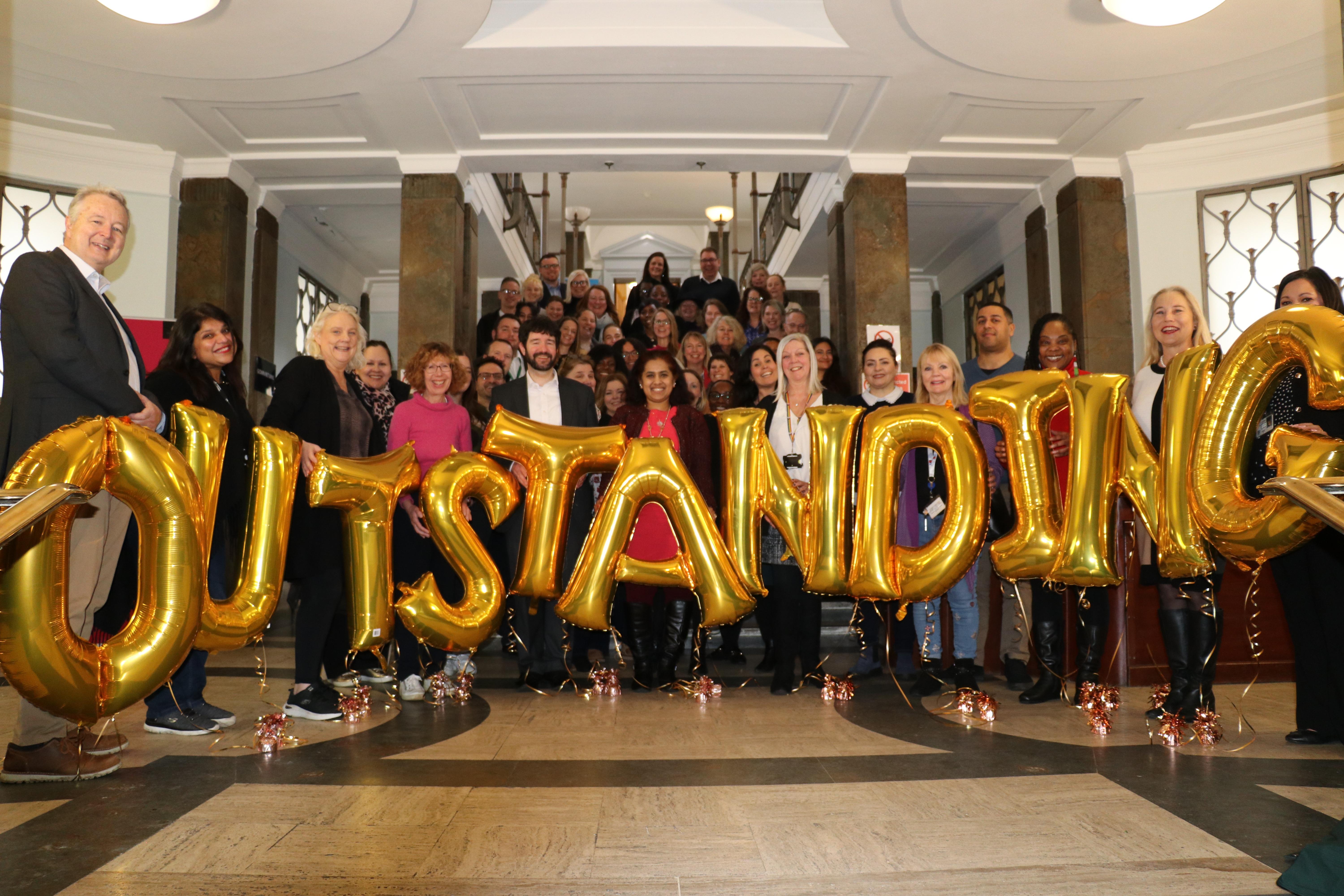 Staff from Kingston Council's Children's Services celebrate their Outstanding Ofsted rating.