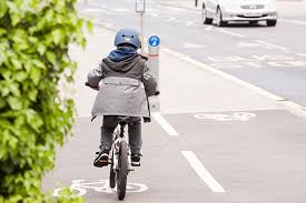 photo of a boy cycling on a dedicated cycle route