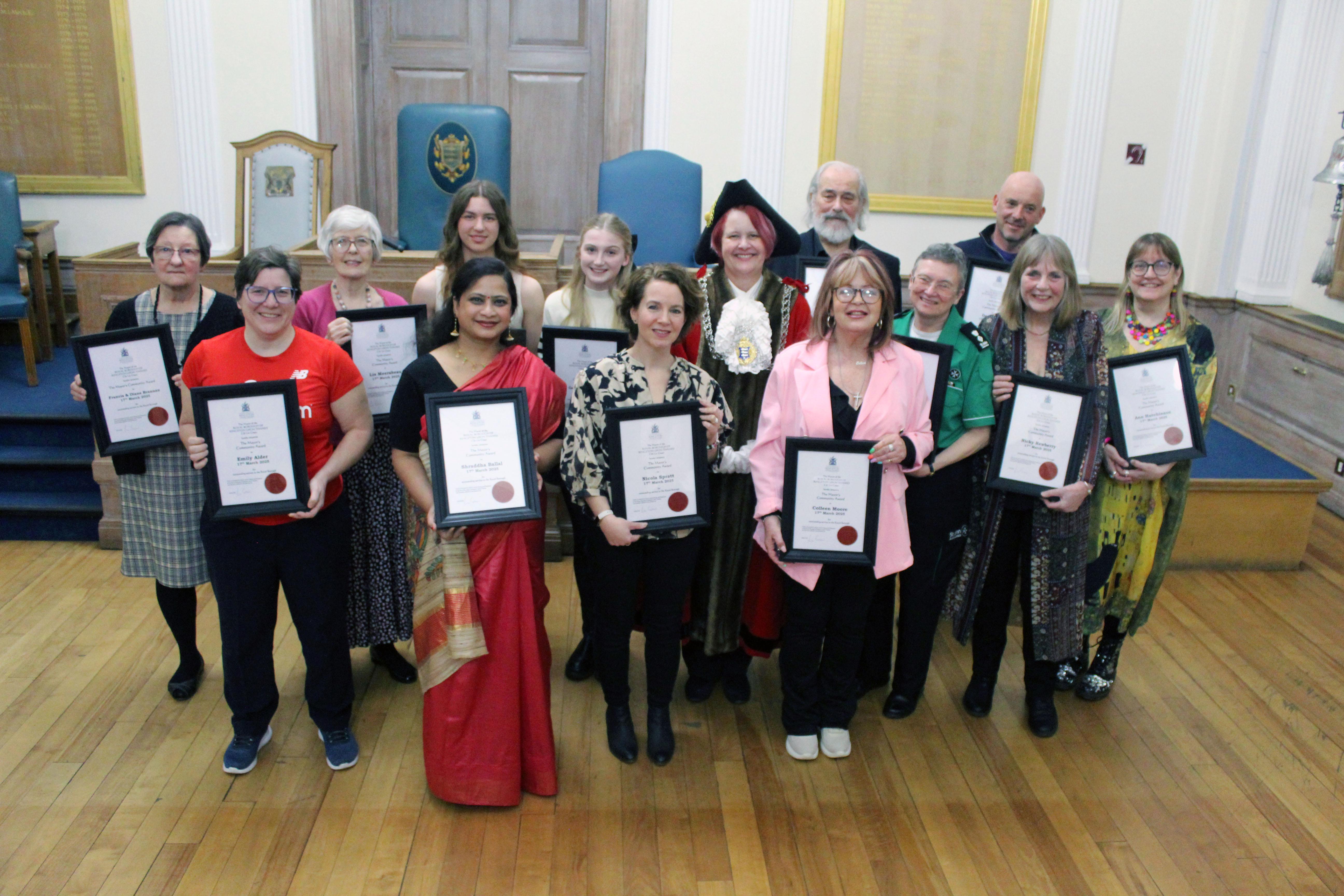 Winners of the 2025 Community Awards pose with the Mayor of Kingston upon Thames